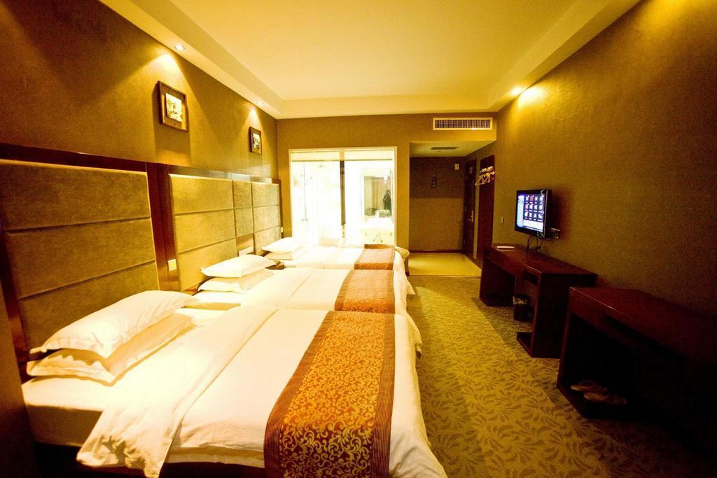 Omeiga Business Hotel Yiwu (Zhejiang) Kamer foto